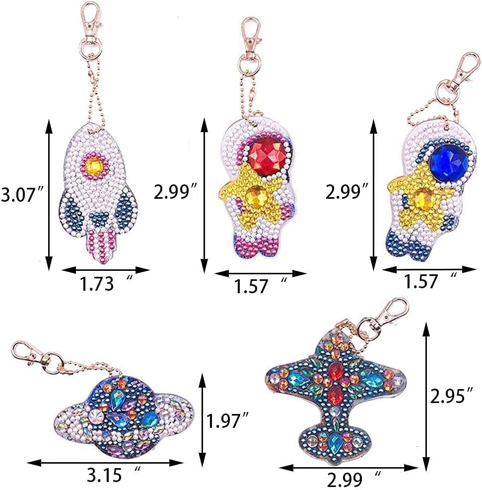 Diagram showing the dimensions of each of the five diamond painting keychains: rocket, astronaut, planet, and airplane.