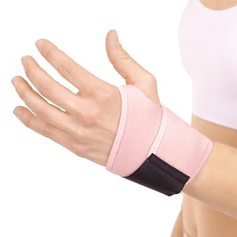 BraceAbility Womens Wrist Support Brace - Pink Right or Left Mommy Hand Copper Compression Wrap for Pregnancy Carpal Tunnel Pain Relief, De Quervains Tenosynovitis Treatment, Arthritis Joint Pain