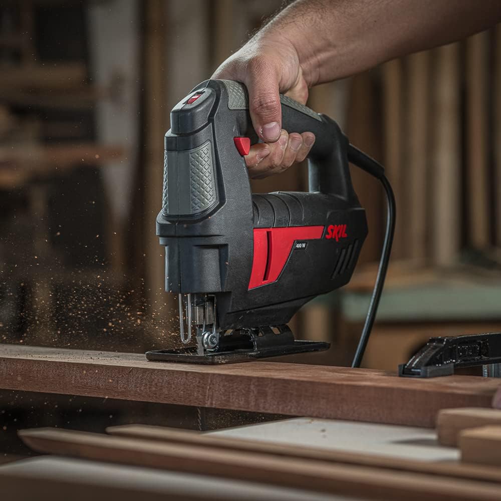 User operating Skil 4400 Jigsaw on wood, close-up