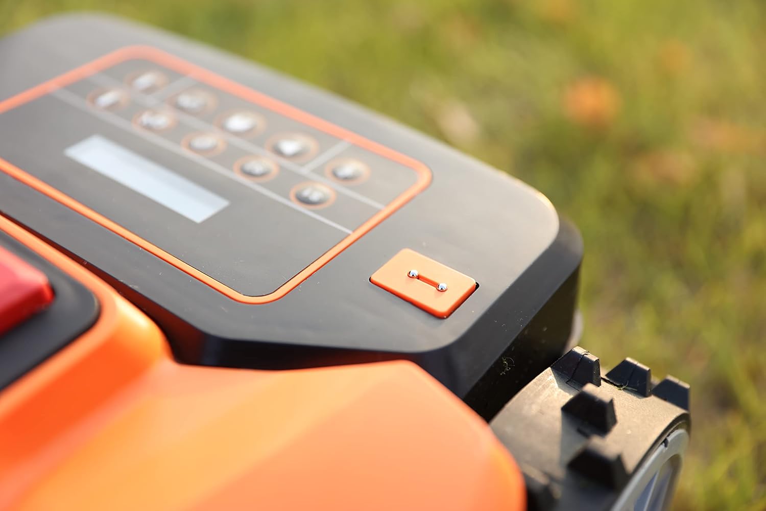 Cutting height adjustment dial on the robotic lawn mower