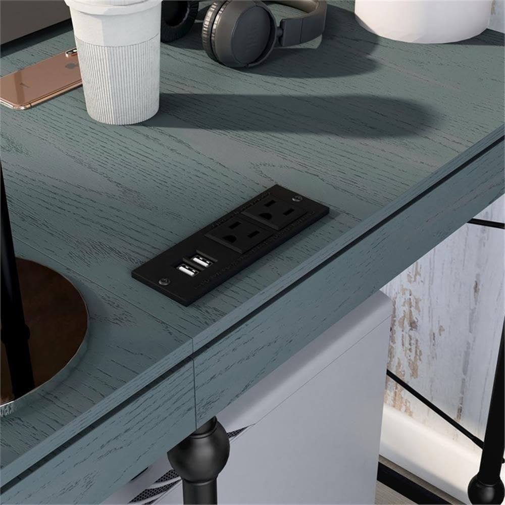 Close-up of integrated power and USB outlets on the desk