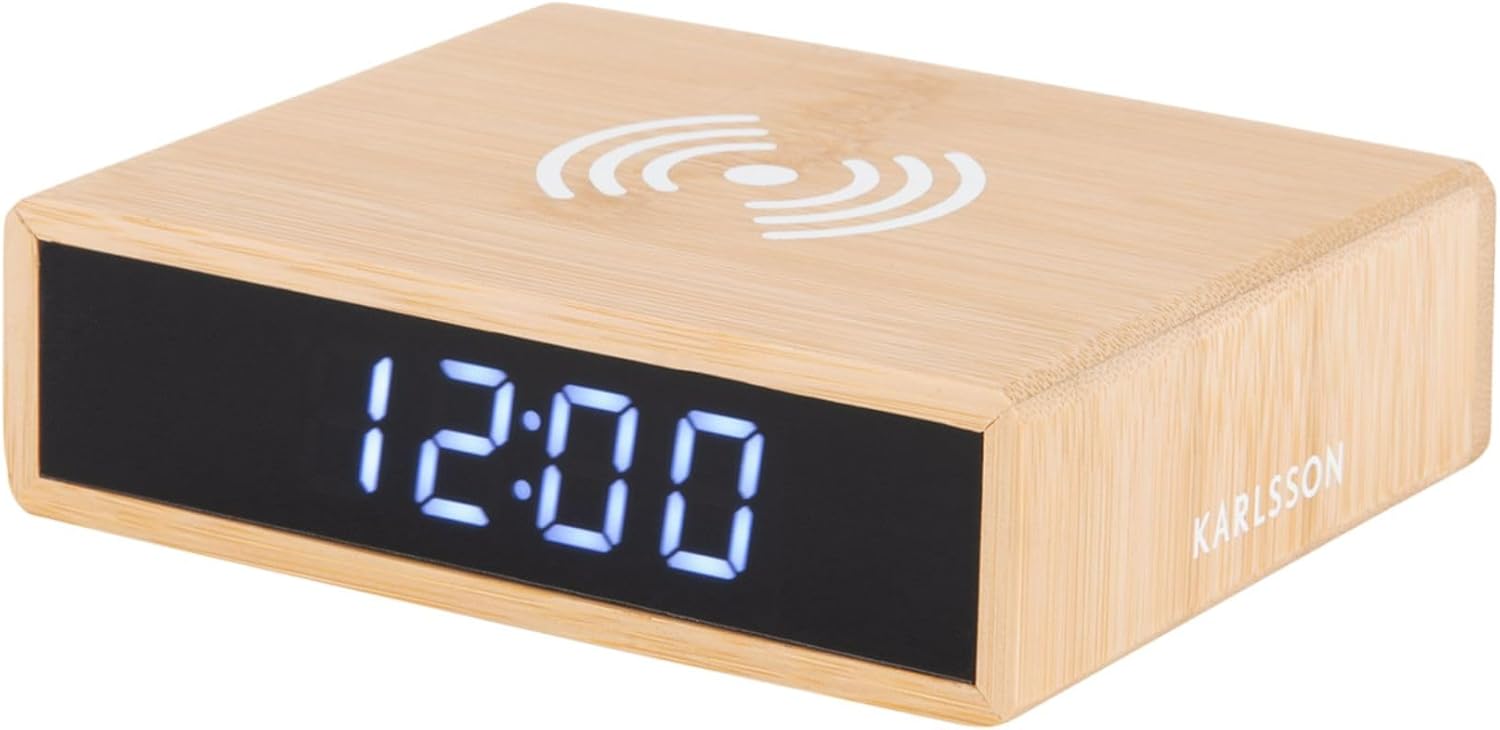 Rear view of the alarm clock showing control buttons, a reset pinhole, and the power input port.