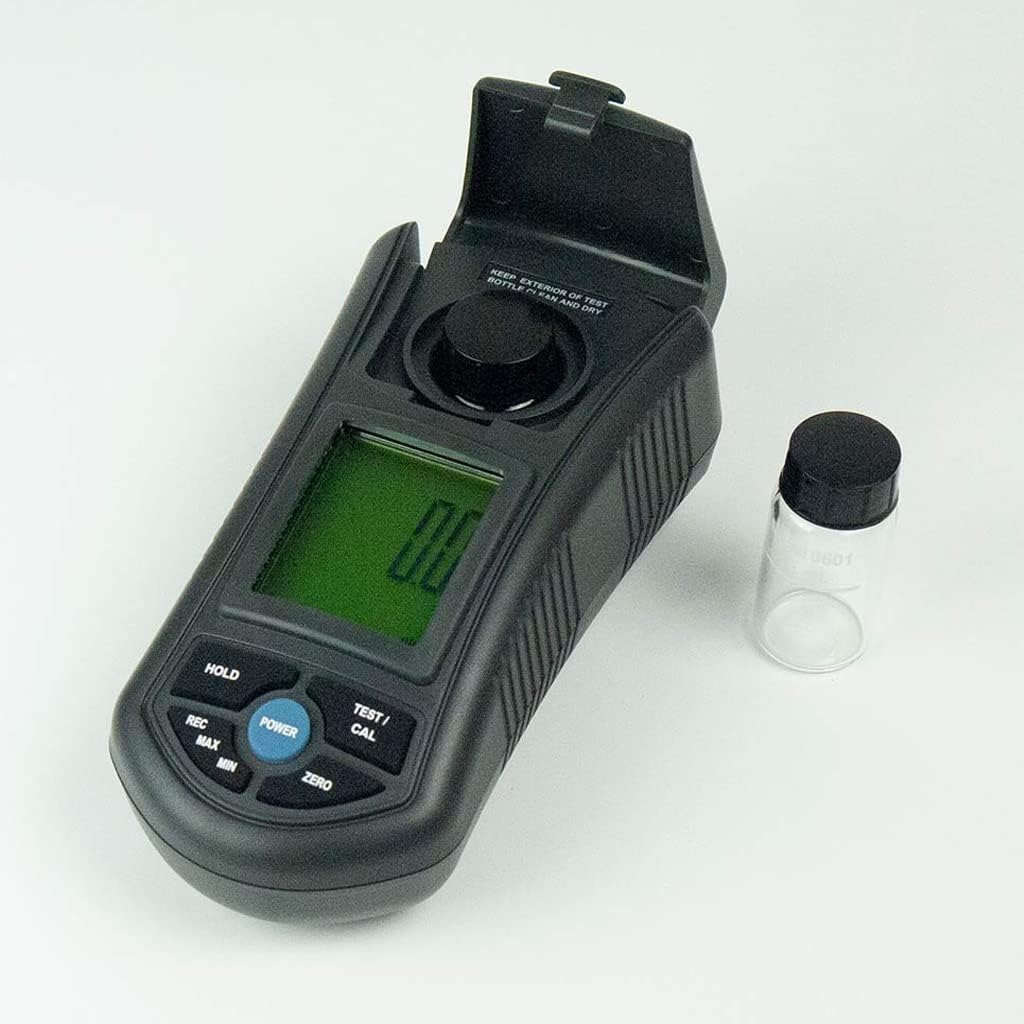 The INSTRUKART Lutron TU-2016 Turbidity Meter with its sample compartment lid open, next to an empty sampലെ ബോട്ടിൽ.