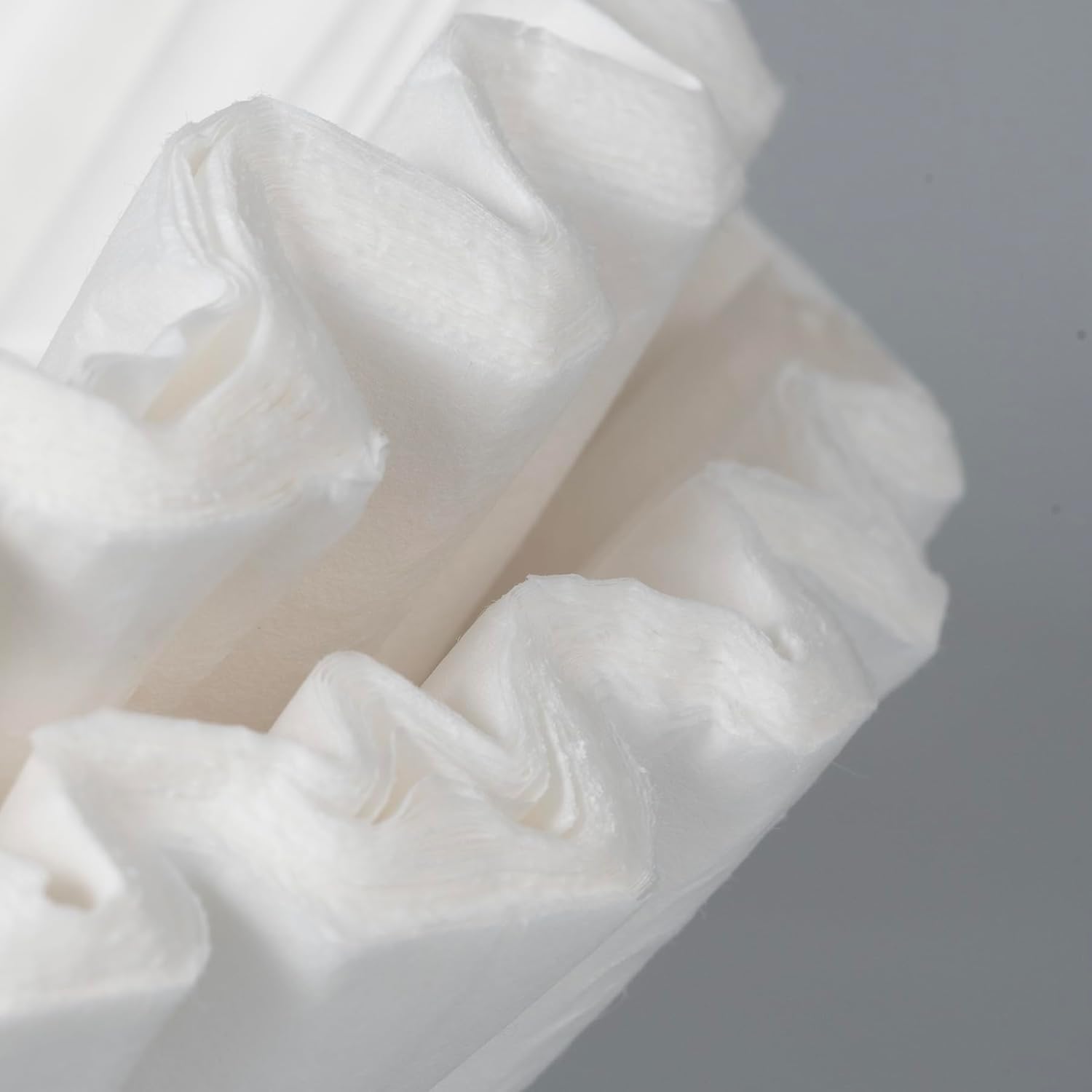 Close-up of the pleated texture of a coffee filter