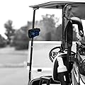 Golf cart featuring a rangefinder with golf bag attached, steering wheel, and container inside, set against a black and white background