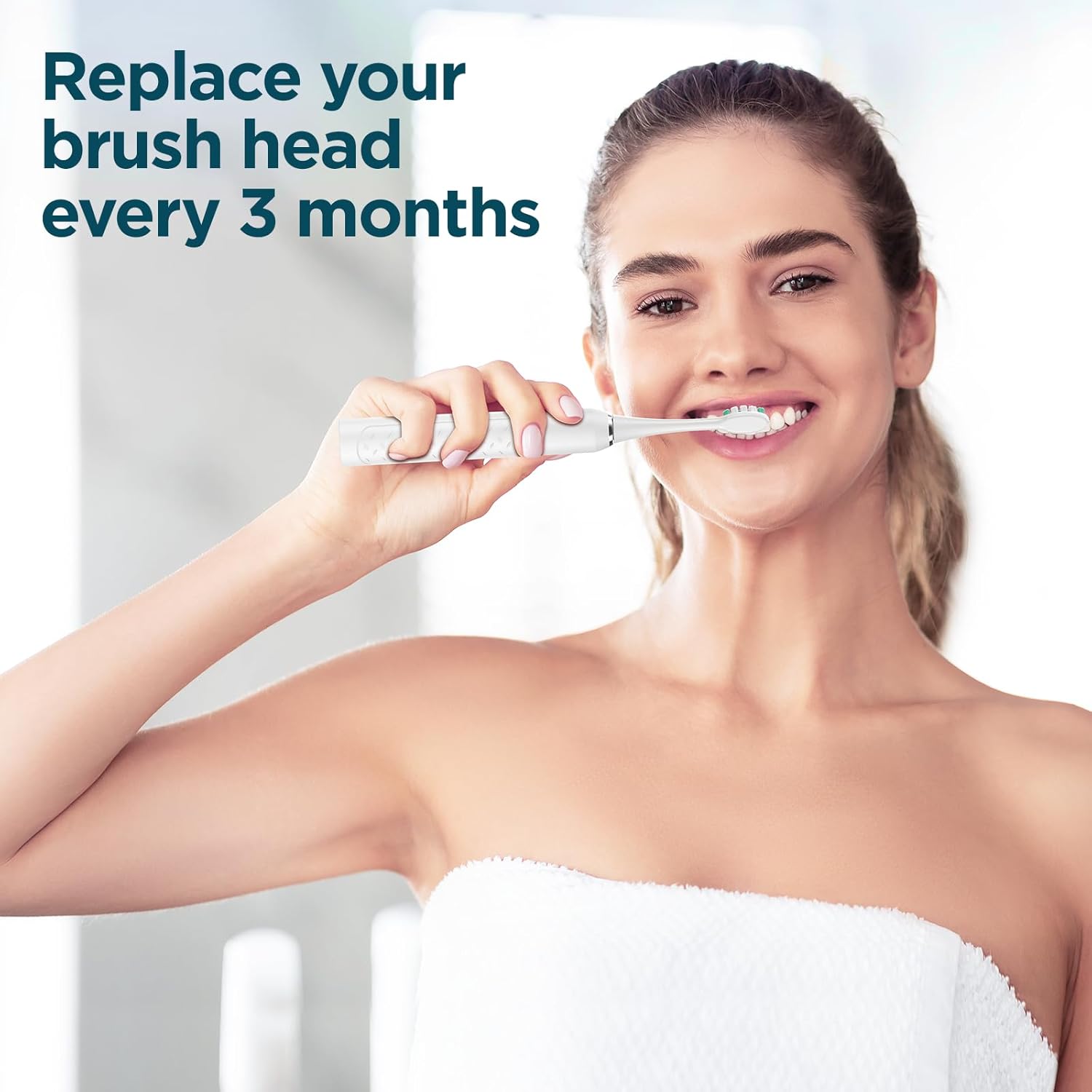 A woman smiling while brushing her teeth with an electric toothbrush, with text overlay 'Replace your brush head every 3 months'.