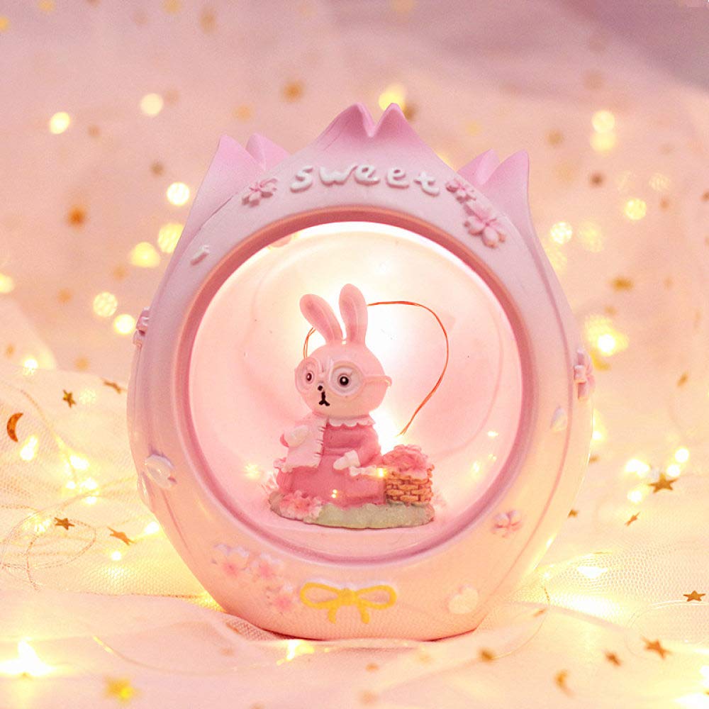 Lampe ronde lapin rose en résine pour décorer une table de chevet ou un meuble