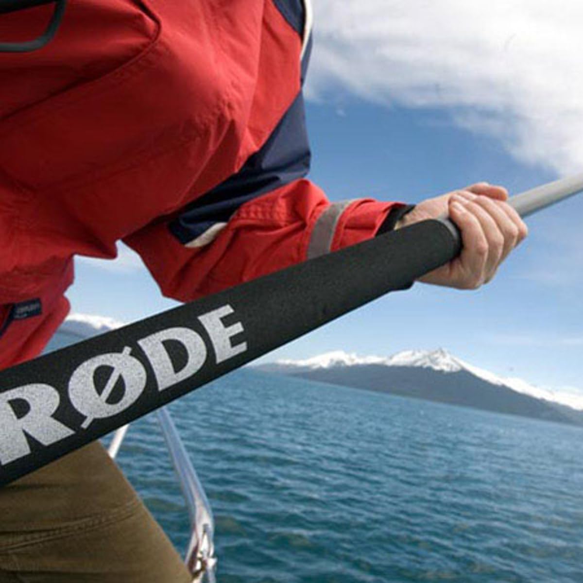 Person holding the Rode Boompole, demonstrating its extension.
