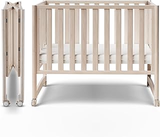 MAMAZING EvoNook 6-in-1 Convertible Mini Crib - Easy Assembly, Portable Folding Baby Mini Crib with Wheels, 100% New Zealand Wood, 4 Adjustable Mattress Heights, Washed Nature with Mattress