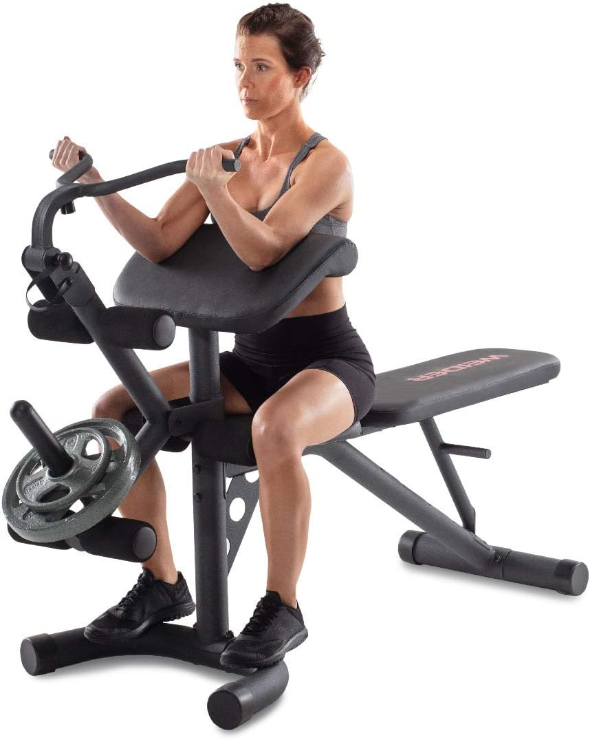 Person performing bicep curls using the preacher pad attachment