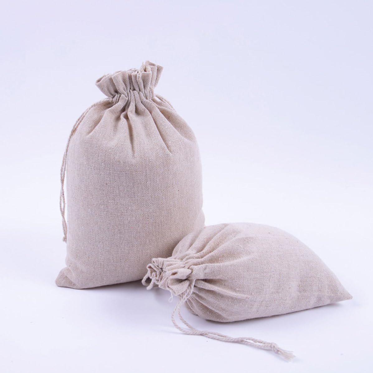 HAKIDZEL 50pcs Reusable Cotton Drawstring Storage Bags for Cosmetics and Ornaments, Easy to Seal and Clean, Beige Foldable Travel and Shopping Pouch for Women