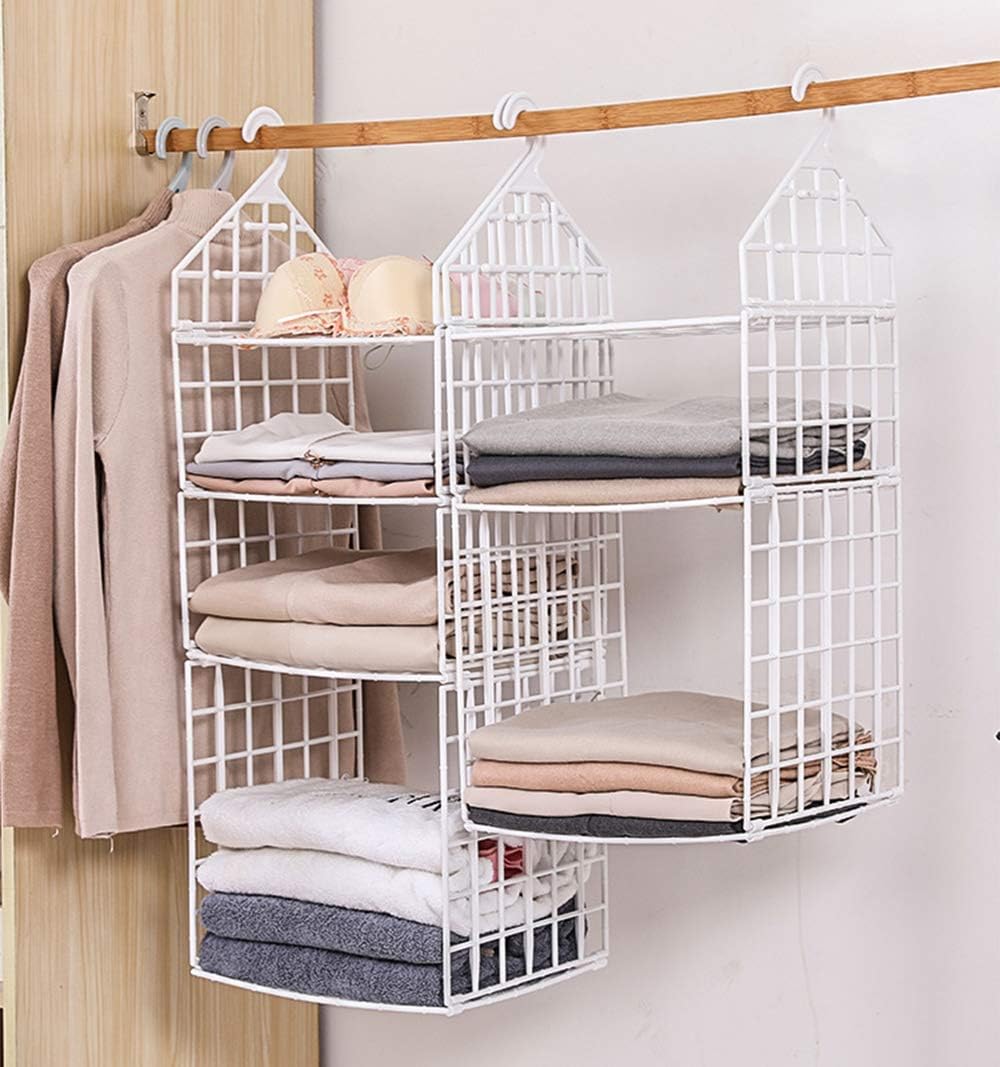 Image showing the Booluee hanging closet organizer in use, suspended from a wooden closet rod, filled with neatly folded clothes and bras on its three tiers. Another hanging garment is visible to the left.