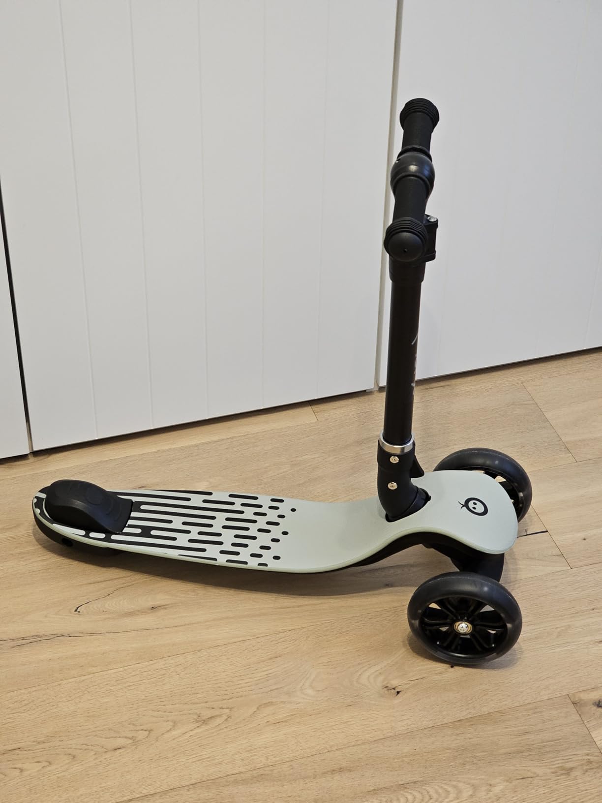 Image showing the MoMi SAN scooter in its folded position for storage.