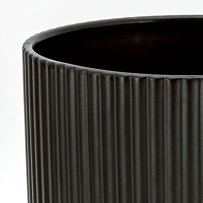 The Amazon Basics Fluted Round Ceramic Planter is an 8-inch planter that is sleek and stylish in design, perfect for adding a modern touch to your indoor or outdoor space. The planter is made of durable ceramic material, making it long-lasting and resistant to wear and tear. It features a fluted round shape that adds visual interest to your plants and flowers.