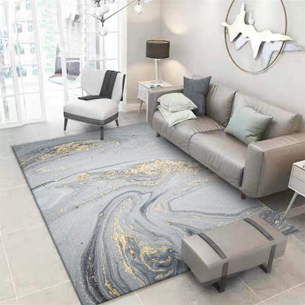 Tapis de sol moderne gris eau dorée pour créer un salon chaleureux et cocooning