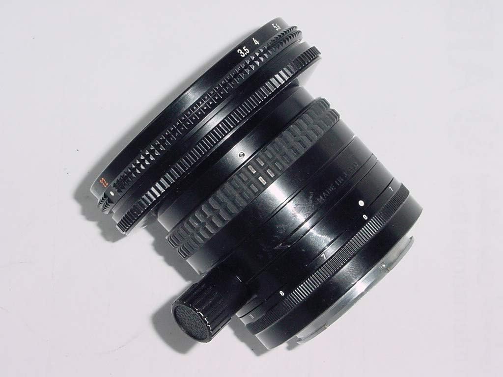 Side view of the Nikon 28mm f/3.5 PC-Nikkor lens, highlighting the shift mechanism and its control knob.