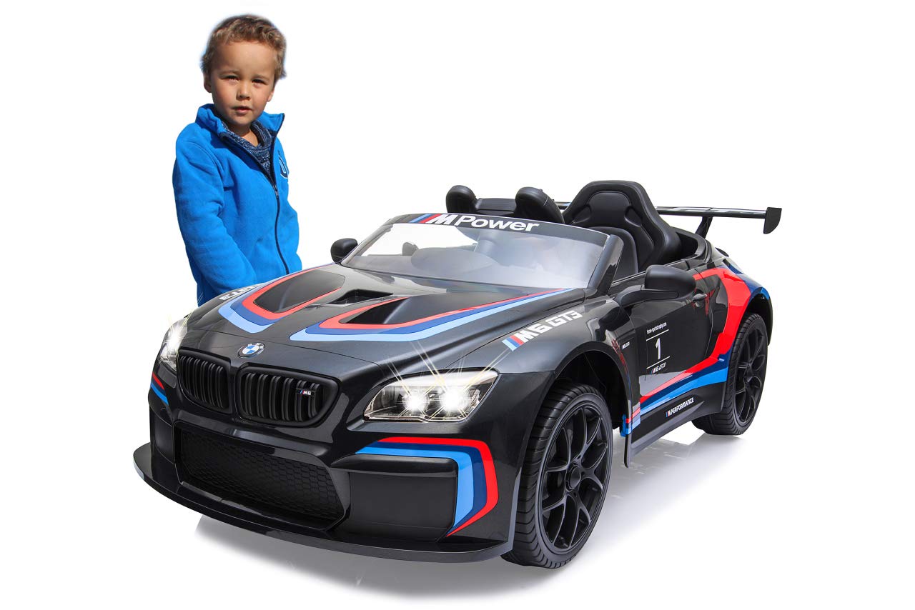 JAMARA 460474 – Ride-on BMW M6 GT3 – potenti motori di azionamento e batteria per lungo tempo di guida, 3 marce, ammortizzatore, connettore AUX, anello in gomma ultra grip, faro LED, nero, grande