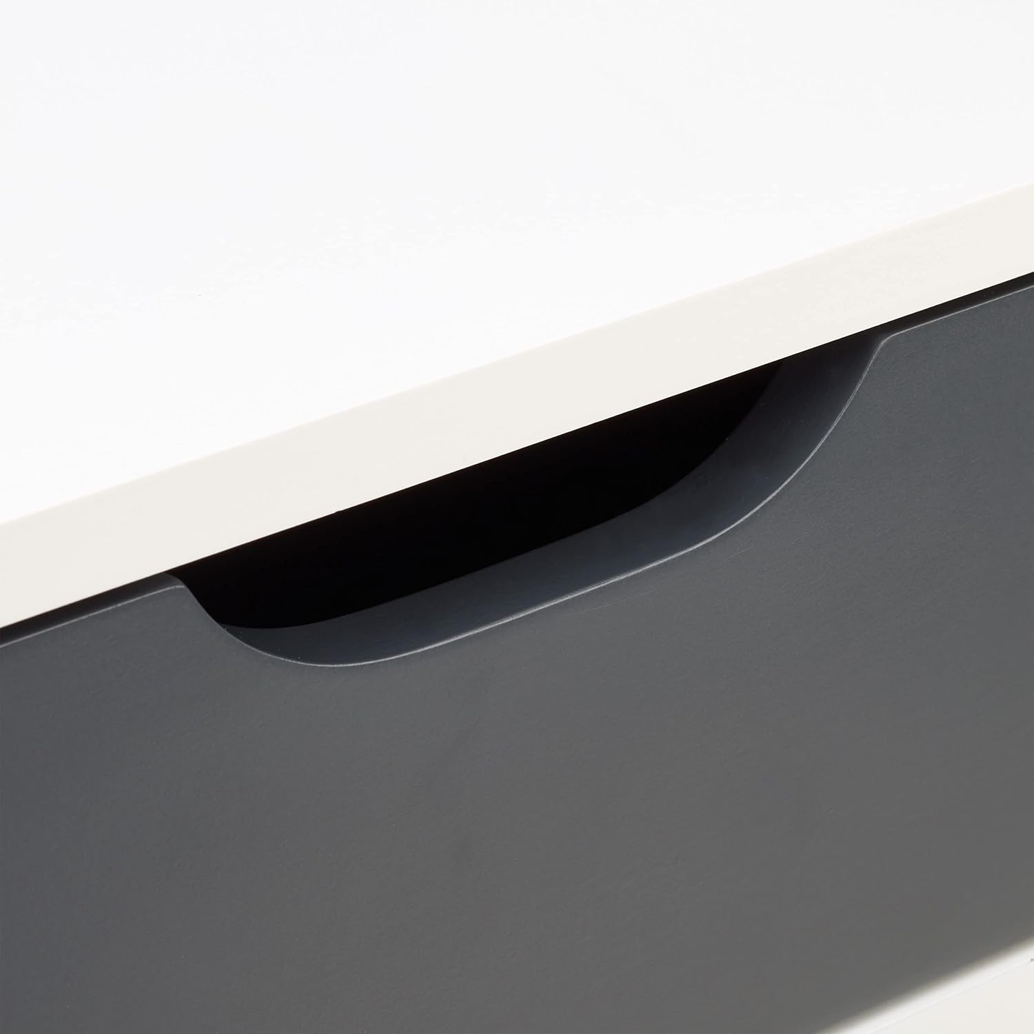 Close-up view of the integrated handle on the Relaxdays nightstand drawer.