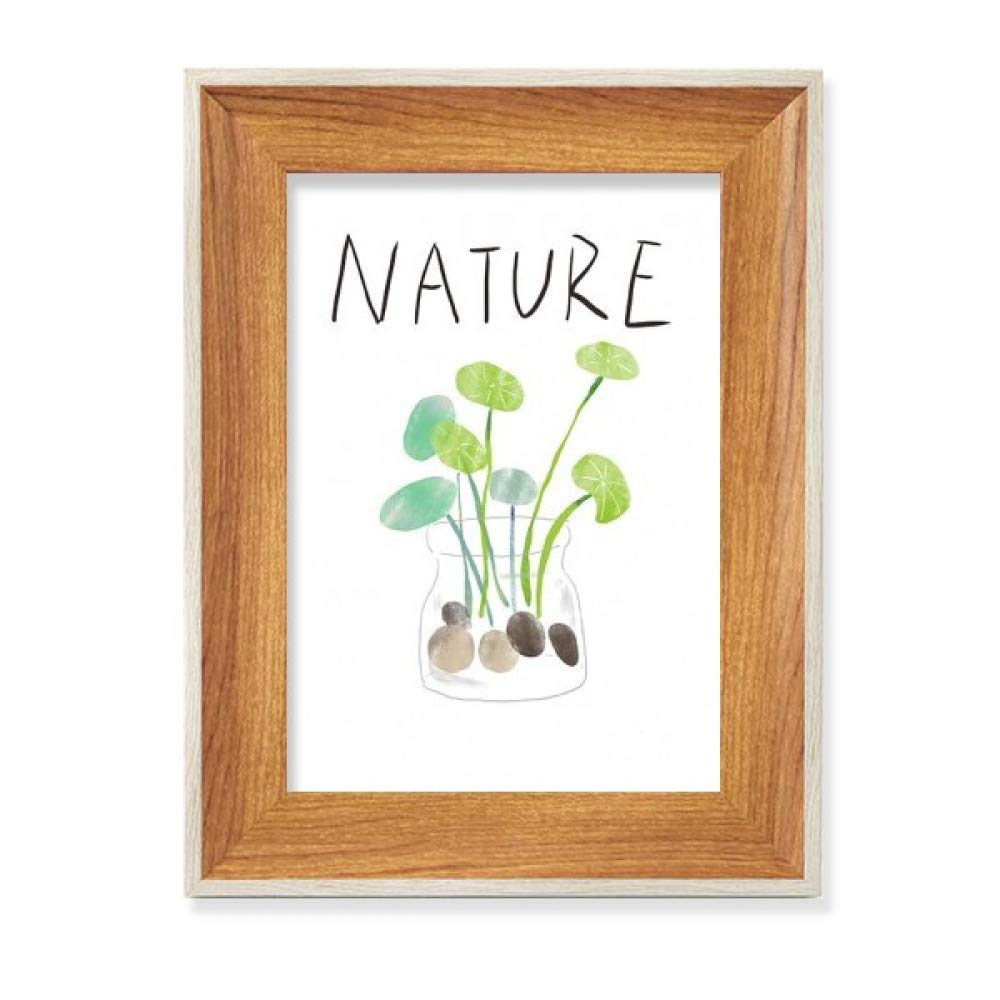 Planta natural en marcos de madera soloisland para un escritorio inspirador