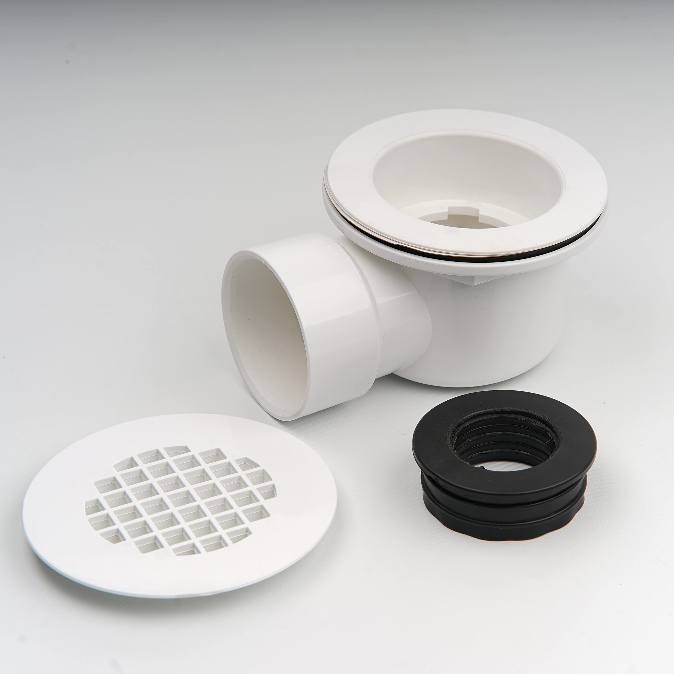 Scarico doccia a basso profilo da 5,1 cm con riduttore da 5,1 cm x 1-1/2" e filtro perforato, scarico laterale in PVC per base doccia e scarico di ricambio
