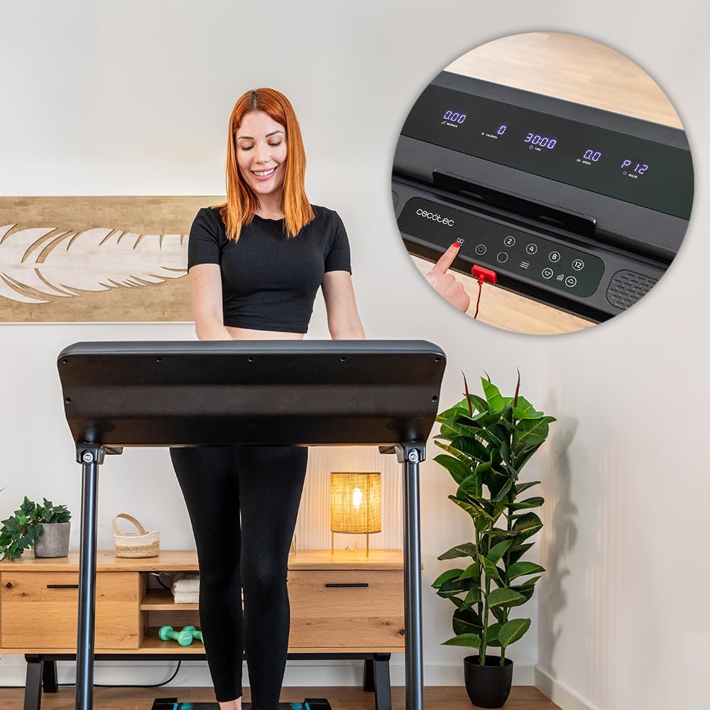 Woman interacting with treadmill control panel