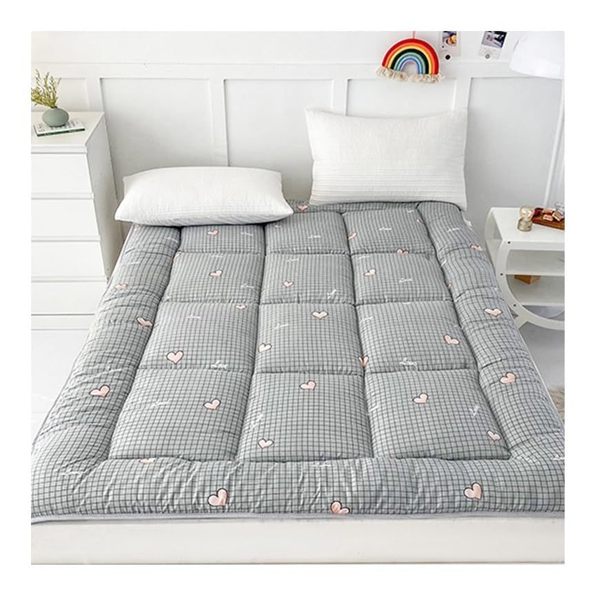Surmatelas en plumes douillet pour transformer votre lit simple en suite de grand hôtel