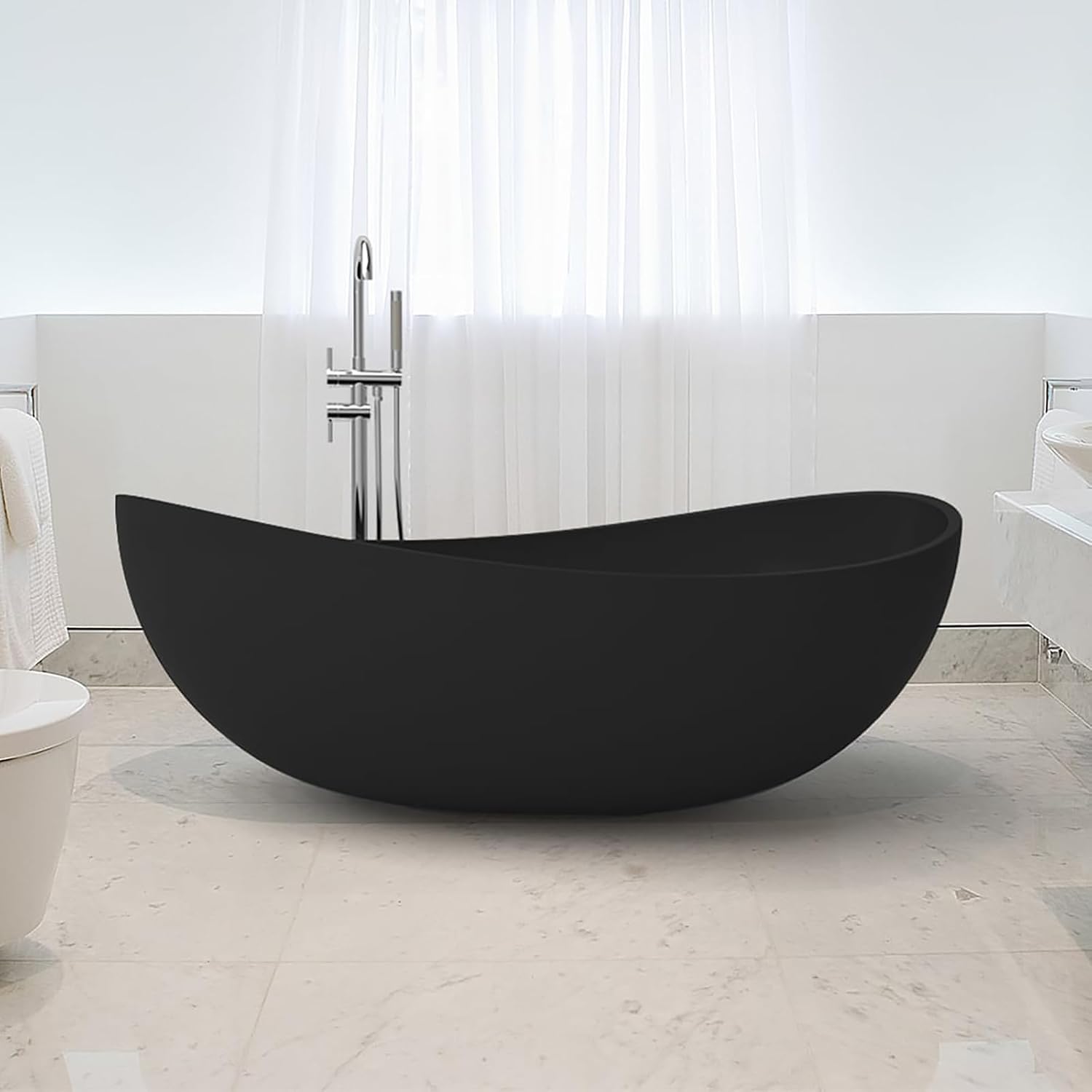 A black oval freestanding bathtub in a modern bathroom setting.