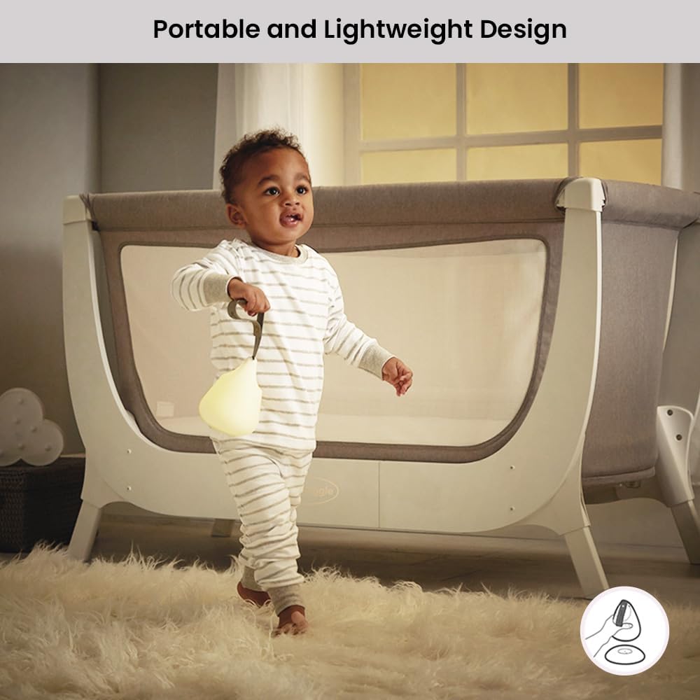 Toddler reading with Shnuggle Moonlight Night Light