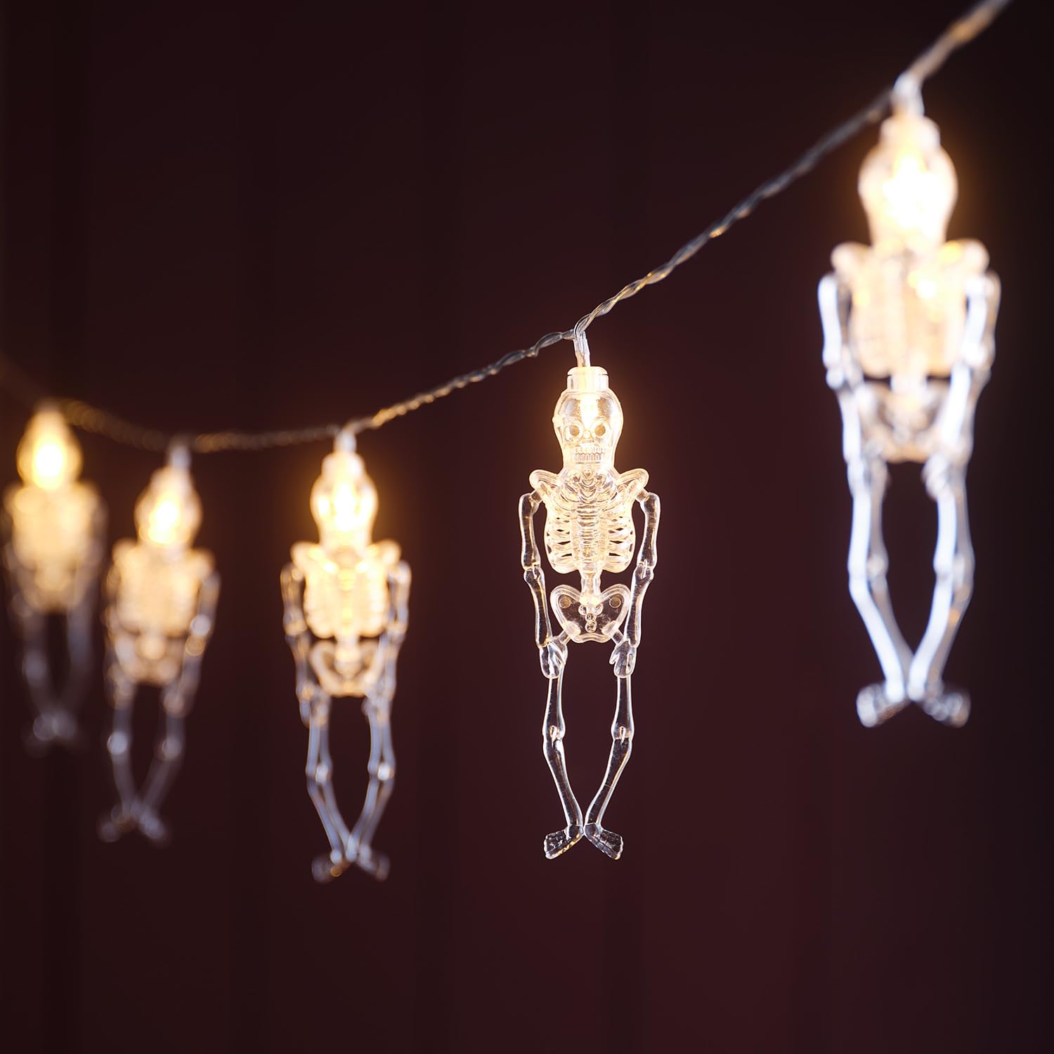 Lights4fun Warm White 1.8M Skeleton Halloween String Lights With 10 Clear Plastic Skeletons, Led Lights, Battery Operated With 6 Hour Timer, Movable Joints, Indoor Spooky Décor For Halloween Parties