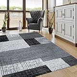 Dieser Designer Kurzflor Teppich in Schwarz, Grau und Weiß bietet eine zeitlose Kachel-Optik