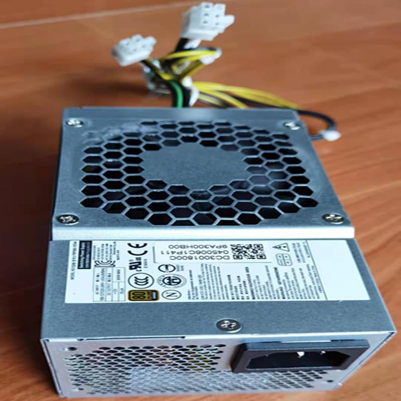 Front view of the 300W power supply unit with fan grille and visible model numbers FSP300-10TAA and PA-2301-3.