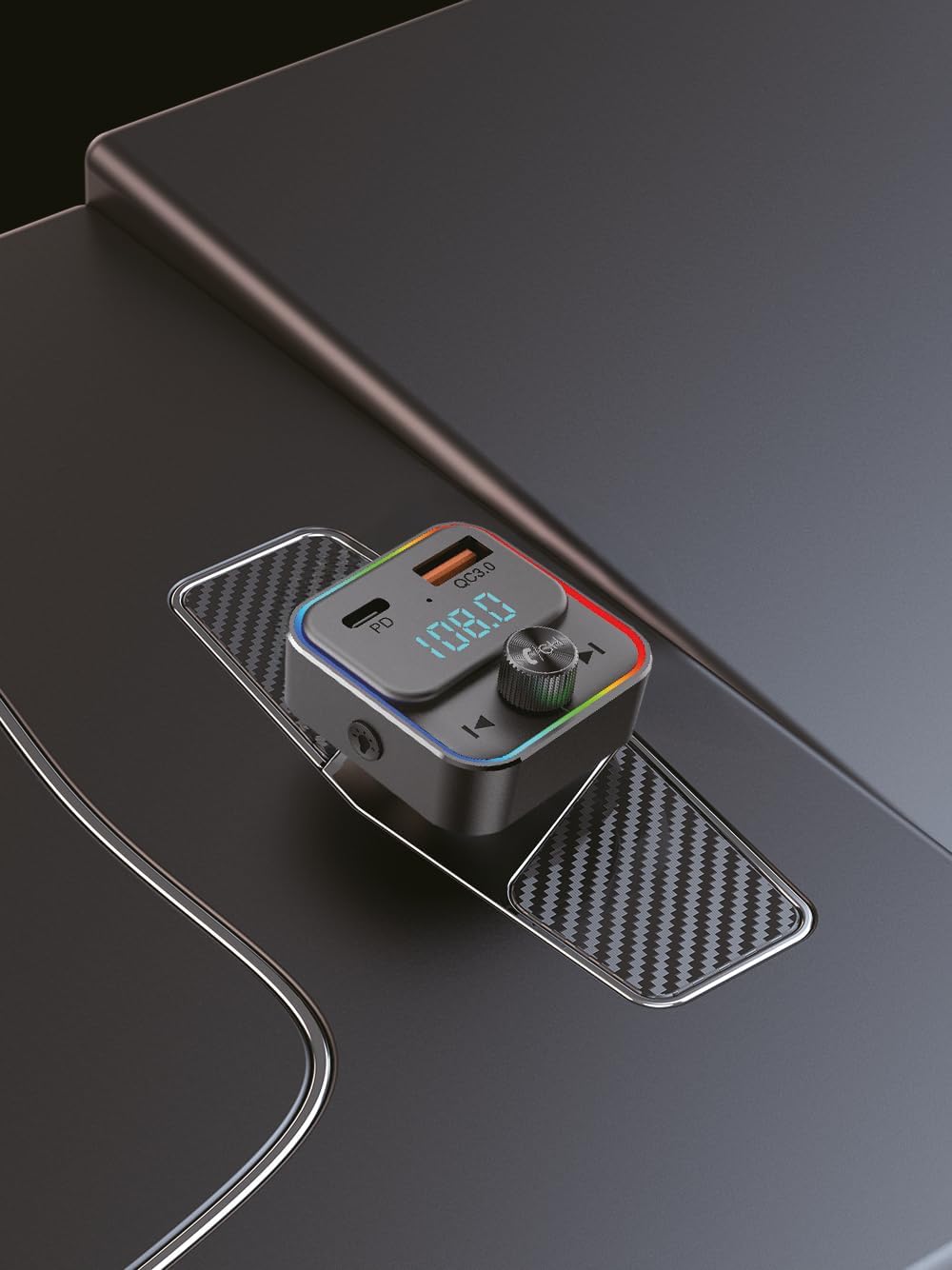 TELESTAR FM-T2 FM Transmitter inserted into a car's cigarette lighter socket.