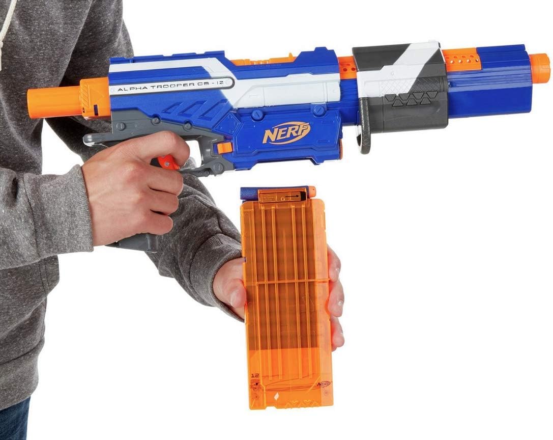 Hand inserting a loaded 12-dart clip into the Nerf blaster