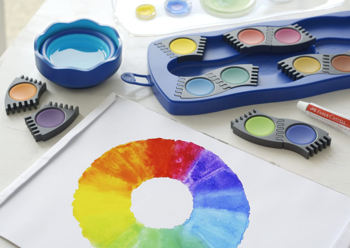 FABER-CASTELL - zestaw farb wodnych Connector, 12 kolorów, niebieski | W zestawie: biel kryjąca, przegródka na pędzel i miejsce na imię, farby można łączyć ze sobą