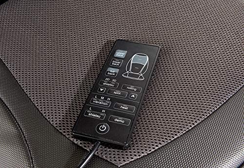Sharper Image Shiatsu Massage Seat Cushion on a chair, front view with remote.