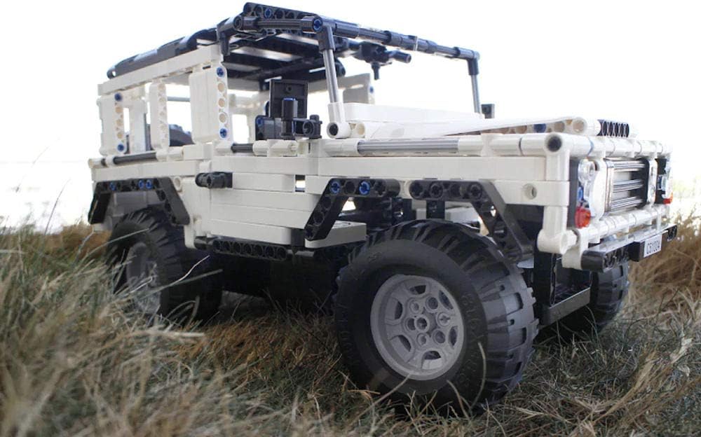 A close-up view of one of the large, textured tires and the detailed wheel hub of the CaDA C51004W