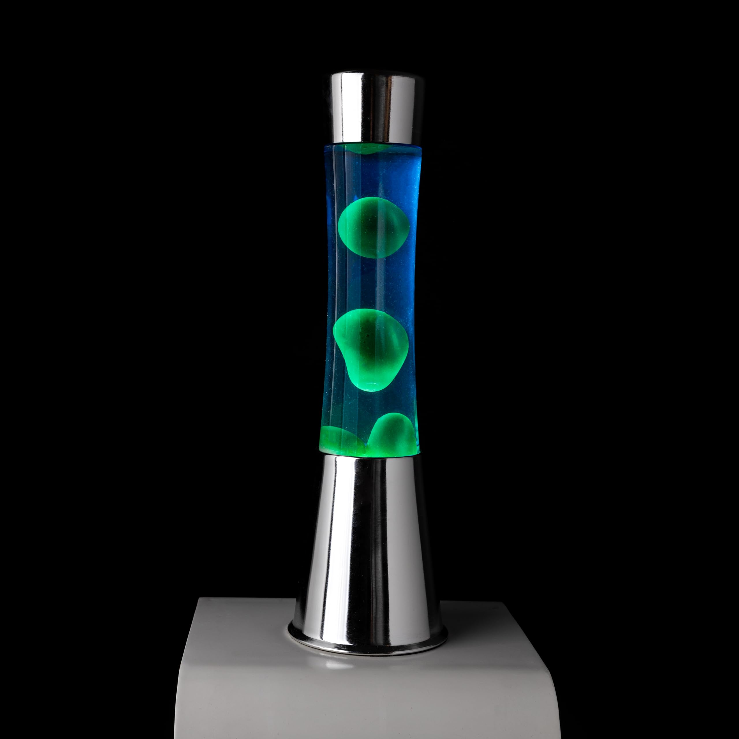 Fisura - Lámpara de lava verde y azul. Base cromada, líquido azul y lava verde. Lámpara efecto relajante. Con bombilla de repuesto. 11 cm x 11cm x 39,5 cm.