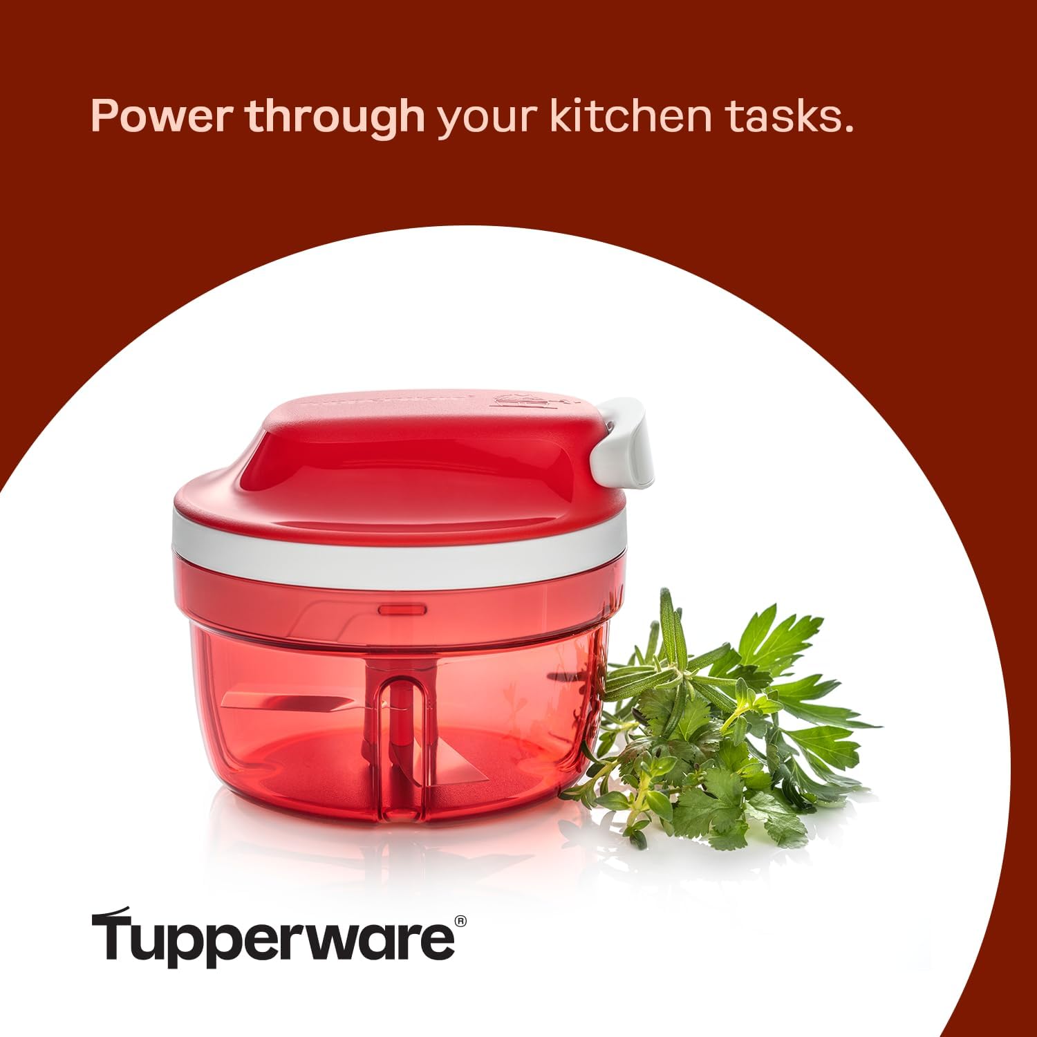 Hands securing the lid of the Tupperware SuperSonic Chopper Compact with ingredients inside