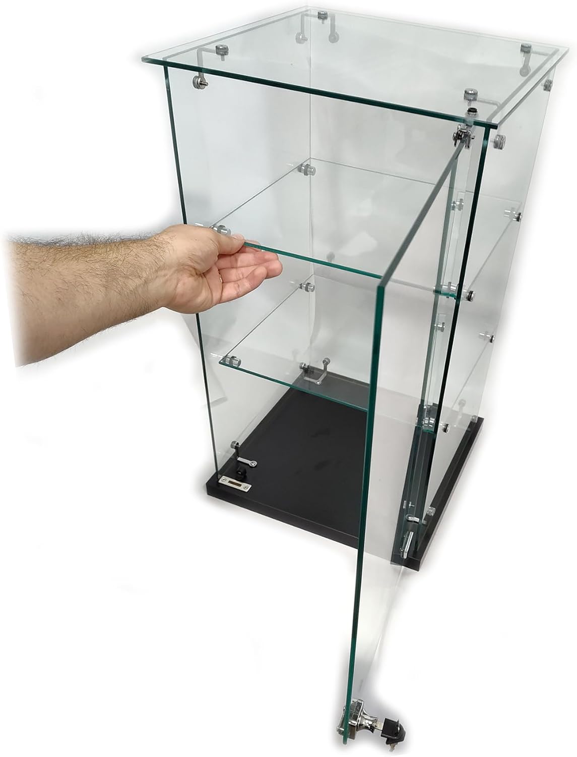 A hand demonstrating the placement of a glass shelf within the display case.
