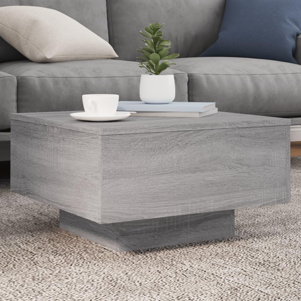 Petite table basse grise pour optimiser le rangement des petits salons