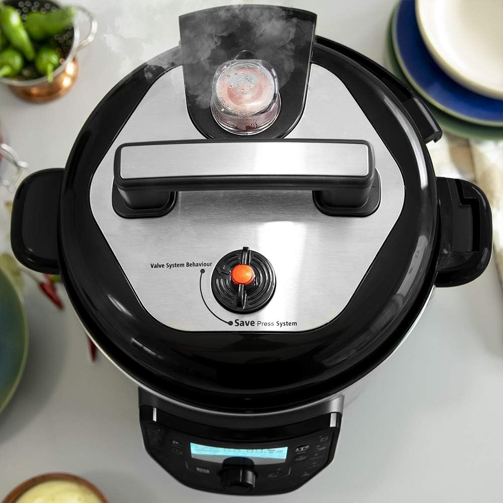 Oke-isalẹ view of the GM H-Deluxe Pressure Cooker's lid, showing the steam release valve.