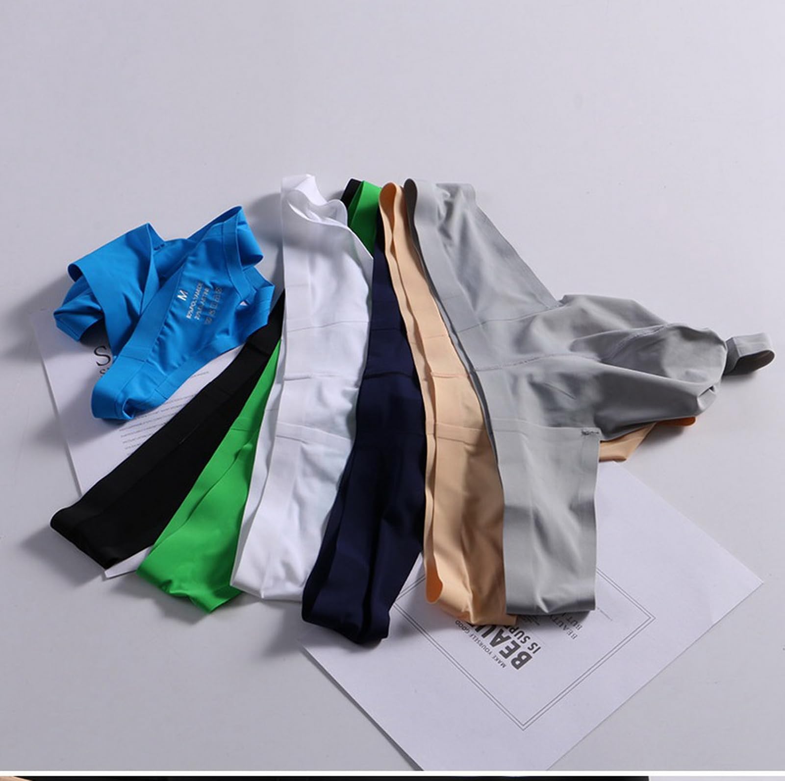 Tanga ultrafina sin costuras de seda de hielo para hombre, sexy, con bolsillos en U, parte trasera en T, bikini de talle bajo