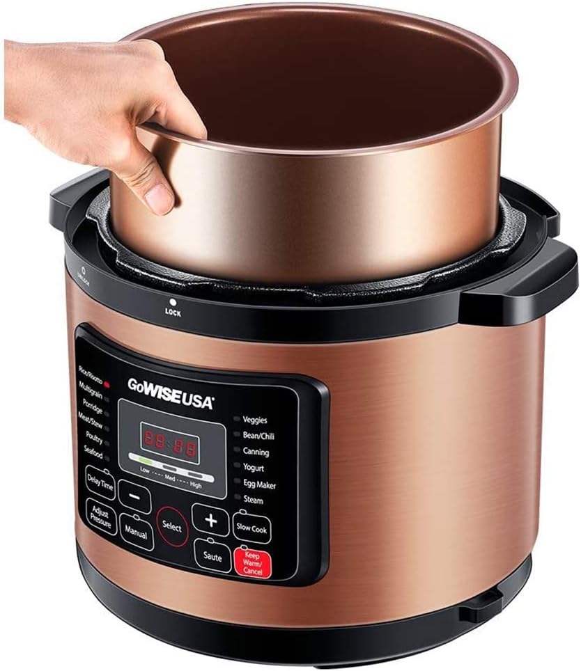 Hand placing ceramic-coated inner pot into GoWISE USA GW22700 Pressure Cooker