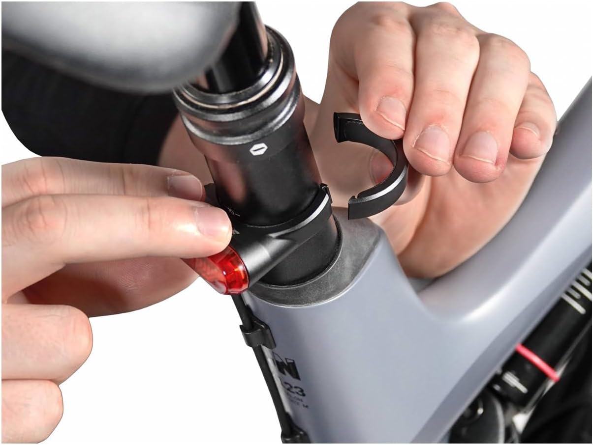 Contents of the Lupine C14 SP package, including the taillight, seatpost clamp, adhesive cable guides, and rubber shims.