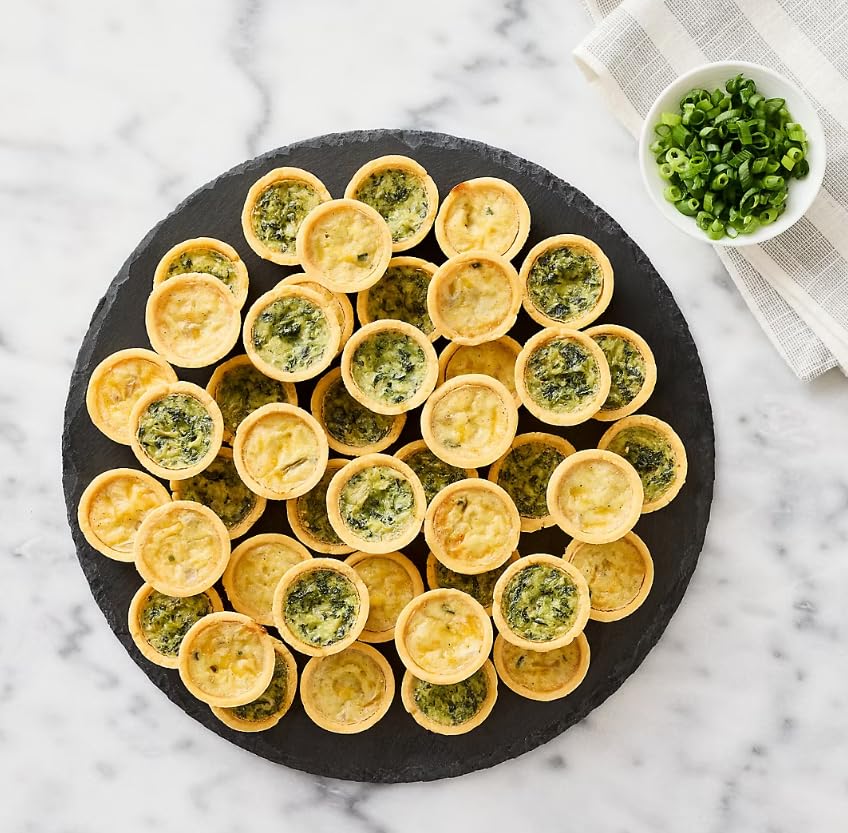 Assorted Mini Quiches , Indulge in the delectable flavors of Assorted Mini Quiches, featuring two mouthwatering varieties: Spinach & Swiss and Three Cheese. Each bite-sized quiche is a perfect blend of savory ingredients encased in a buttery, flaky pastry crust. offering a delightful harmony of flavors with every bite. 48 ct .. [ 36 oz , 2.25 lb ]