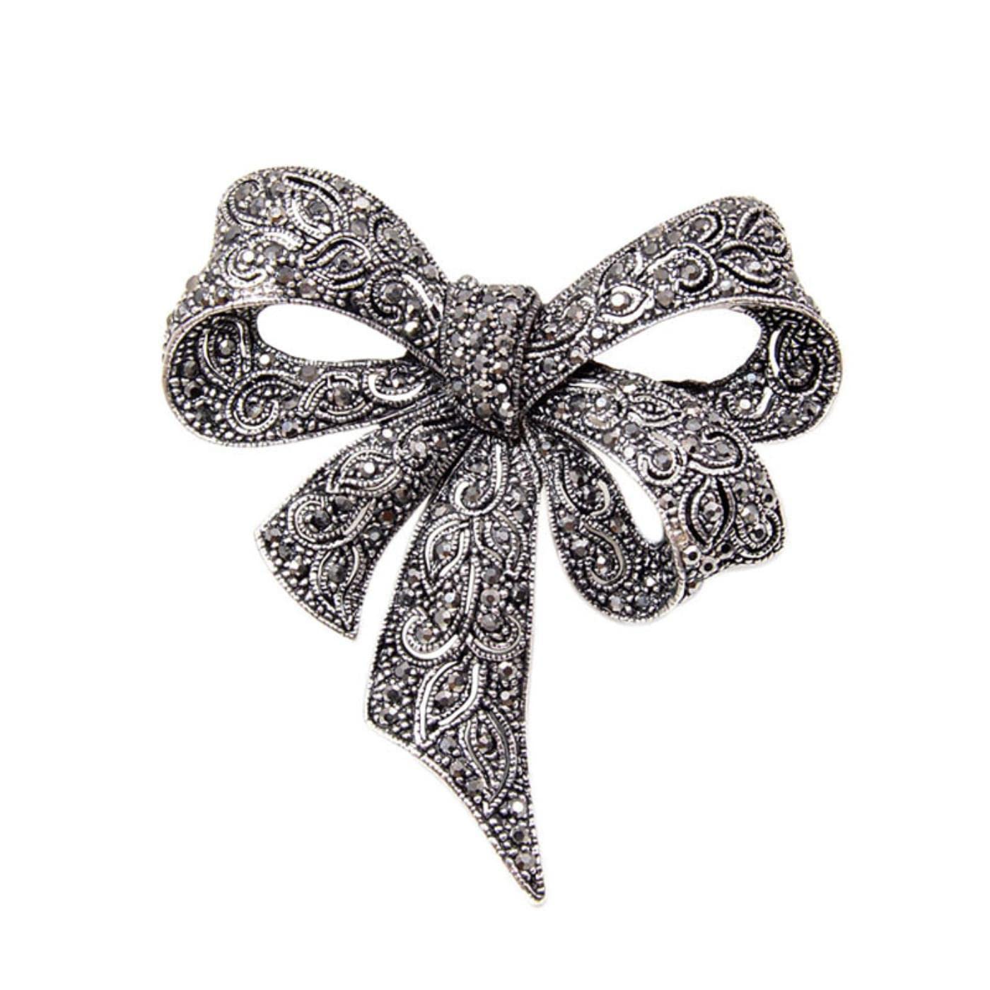 Broche vintage vintage avec grand nœud et gros nœuds dorés