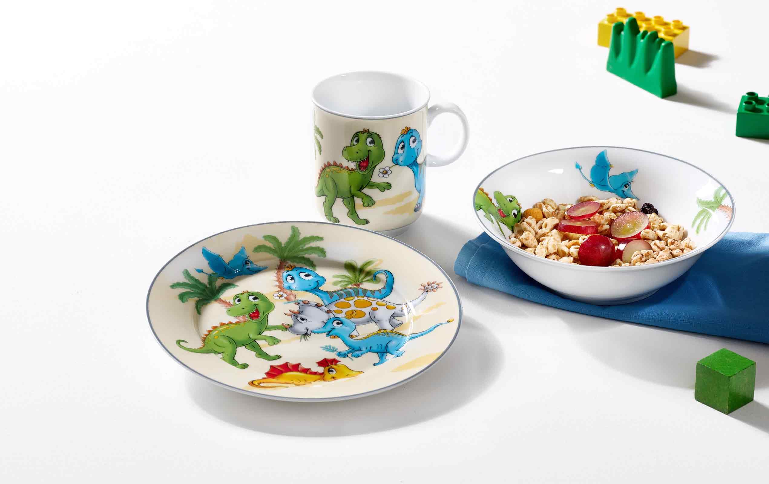 Ritzenhoff & Breker Set di stoviglie per bambini con tovagliette a forma di dinosauro, 4 pezzi, colorate, ciotole, bicchieri, piatti in porcellana, 45 x 30 cm, set per bambini con motivi di dinosauri