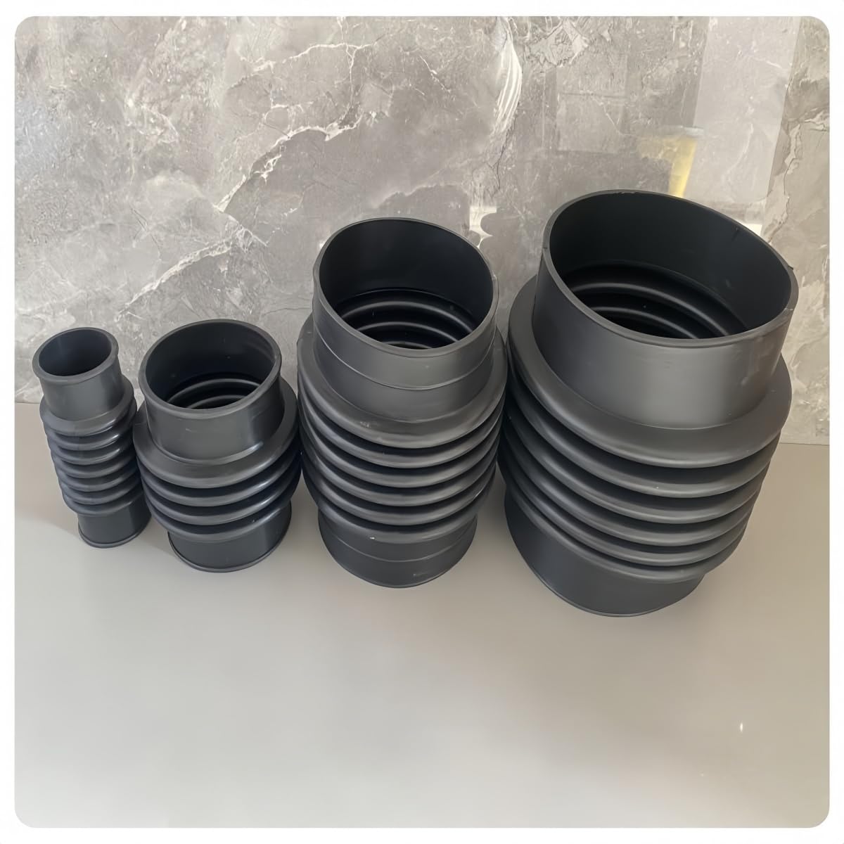 Gummiflex - Tubo corrugado con abrazaderas para manguera, color negro, pieza de goma resistente a altas temperaturas para aguas residuales, bombas e instalaciones domésticas (DN110 x 400 mm +