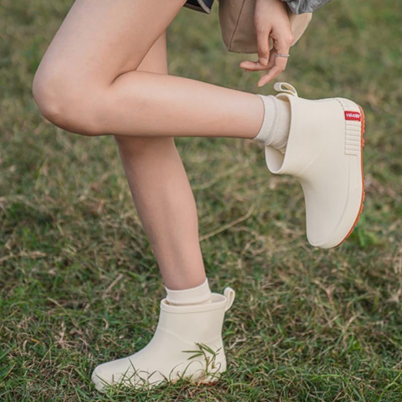 Women's fashionable short boots with flat round toe and PVC upper. Comfortable and slip-resistant. Suitable for outdoor and kitchen work.