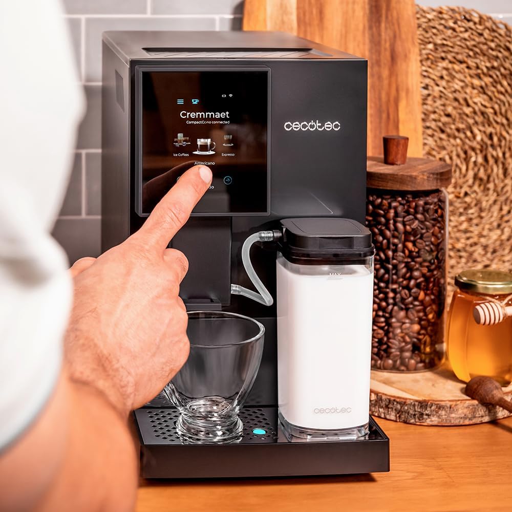User interacting with the coffee machine's TFT touch screen
